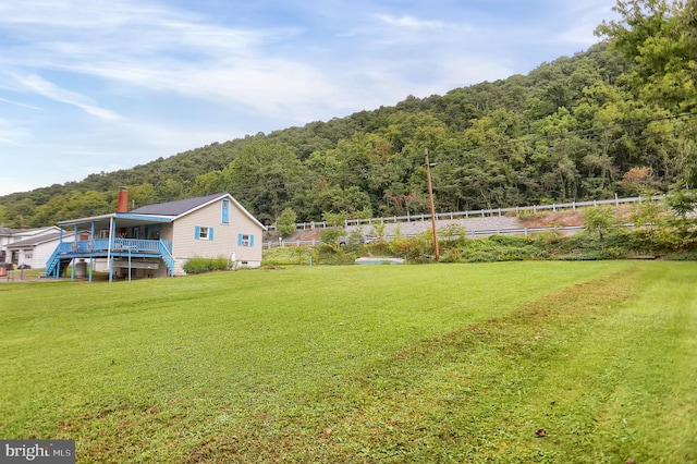 view of yard with a deck