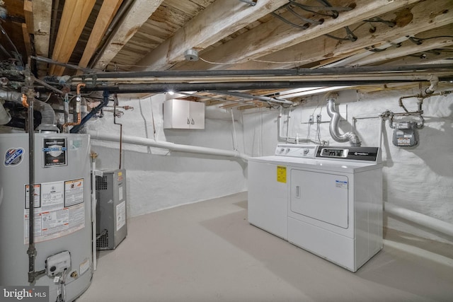 basement with washer and clothes dryer and gas water heater