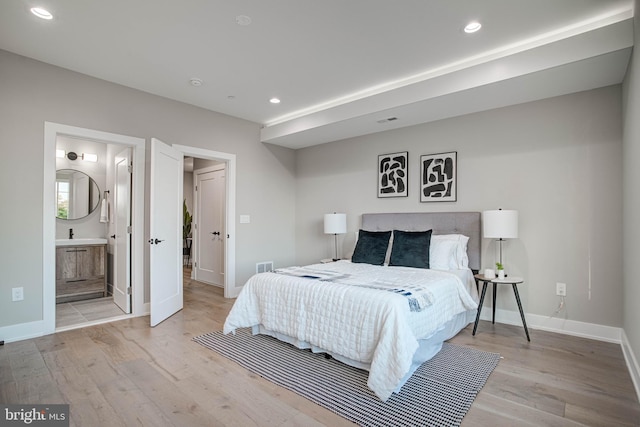 bedroom featuring recessed lighting, visible vents, and light wood-style floors