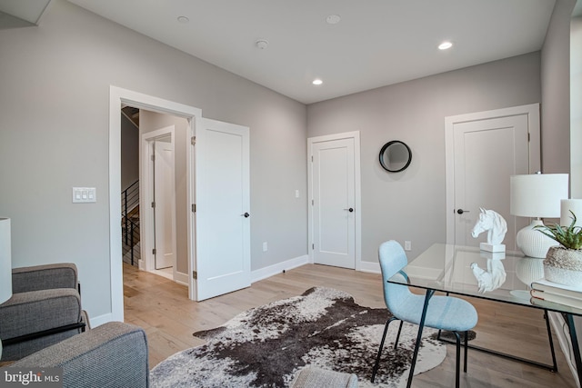 office with recessed lighting, light wood-style flooring, and baseboards