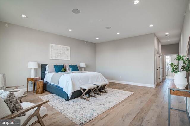 bedroom with light wood-type flooring