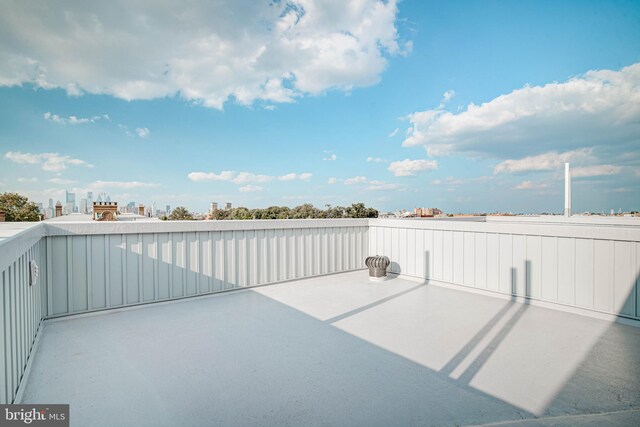 view of patio featuring a balcony