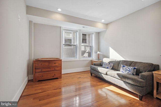 living room with light hardwood / wood-style flooring