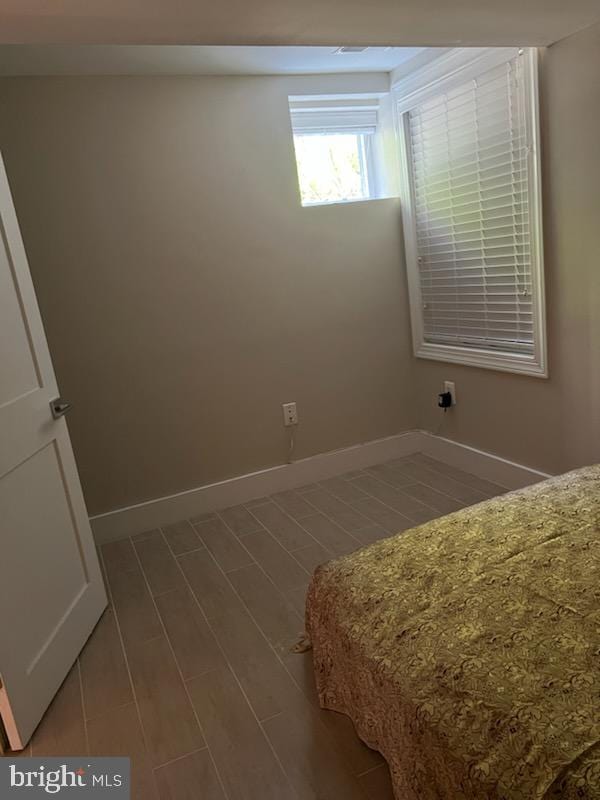 bedroom with hardwood / wood-style flooring