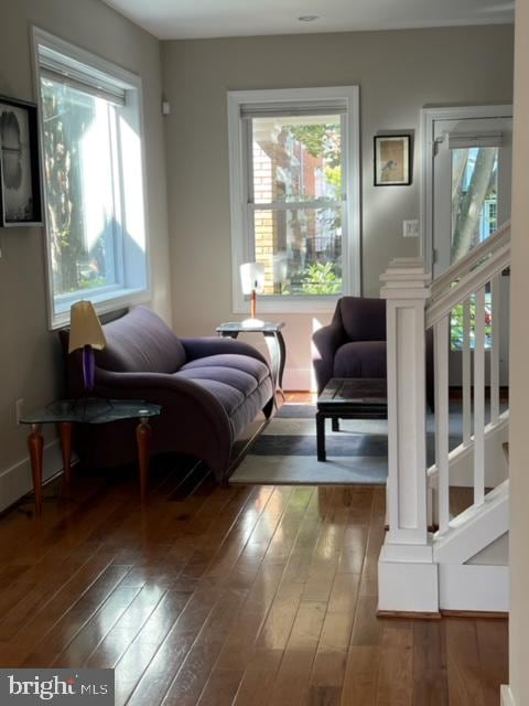 interior space with plenty of natural light and dark hardwood / wood-style floors