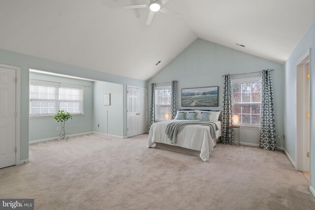 bedroom featuring ceiling fan, high vaulted ceiling, and light colored carpet