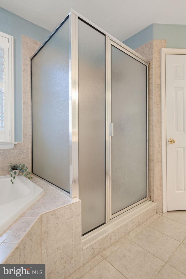 bathroom featuring tile patterned floors, vanity, and walk in shower