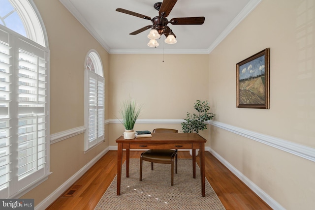 entryway with a wealth of natural light, a high ceiling, and hardwood / wood-style flooring