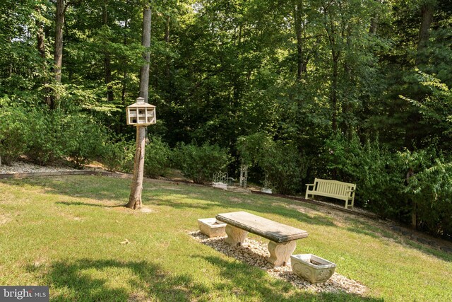 view of front of home with a garage and a front lawn