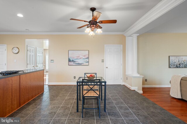 living room featuring a notable chandelier, light hardwood / wood-style floors, crown molding, and decorative columns