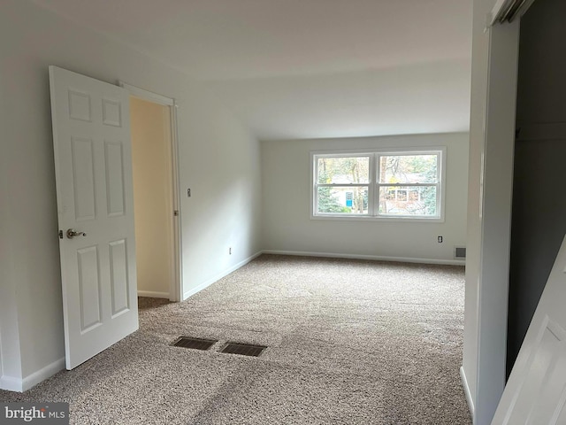 empty room featuring carpet flooring