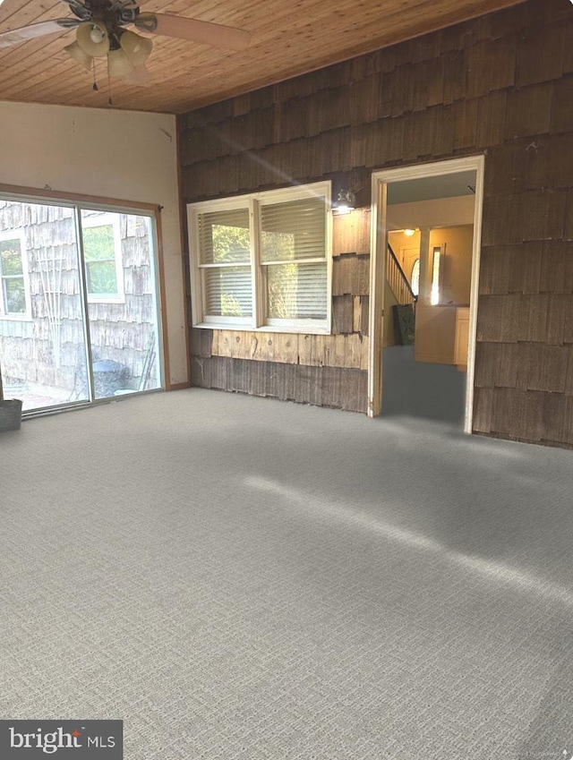 interior space with wooden ceiling and ceiling fan