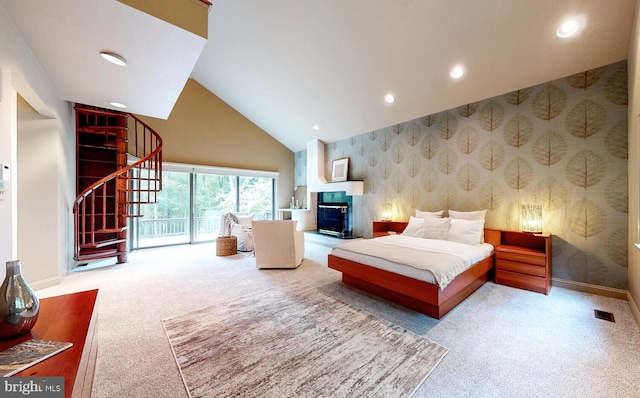 bedroom featuring light colored carpet, access to exterior, and high vaulted ceiling