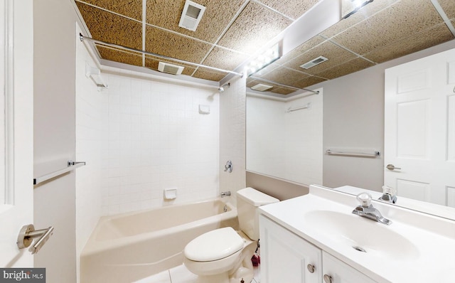 full bathroom featuring tiled shower / bath combo, vanity, and toilet