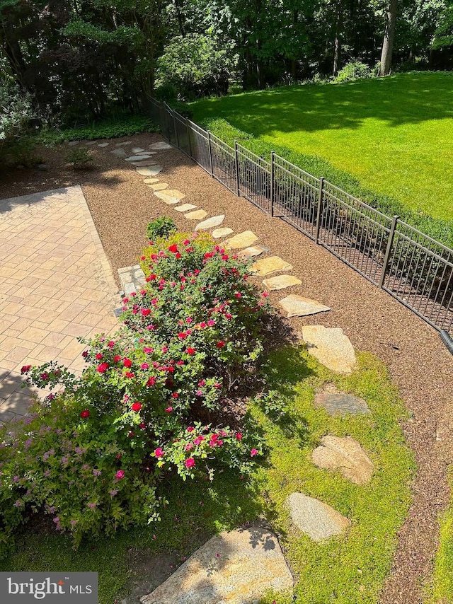 view of yard featuring a patio and fence