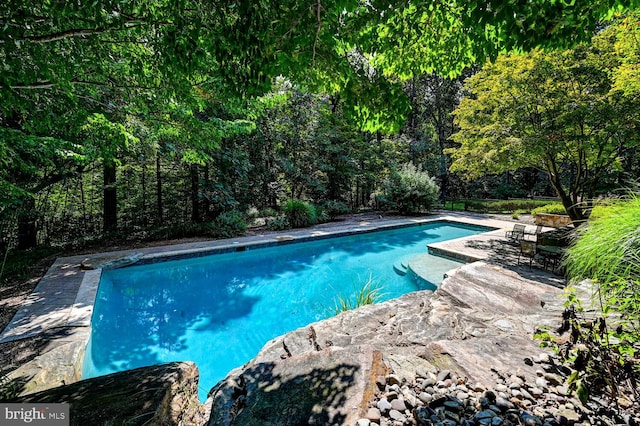 outdoor pool featuring a patio area