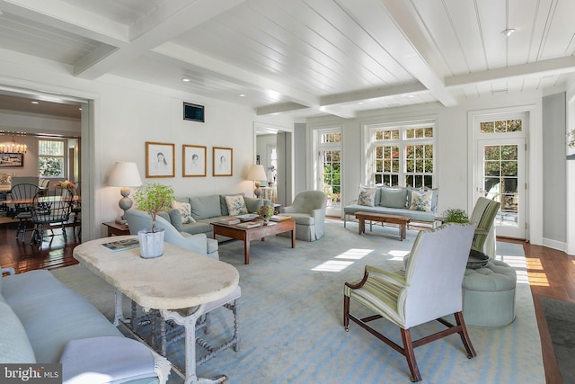 interior space featuring hardwood / wood-style floors, beam ceiling, and a notable chandelier