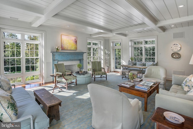 sunroom with plenty of natural light and beam ceiling