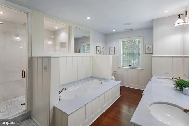 bathroom with separate shower and tub, hardwood / wood-style flooring, and vanity