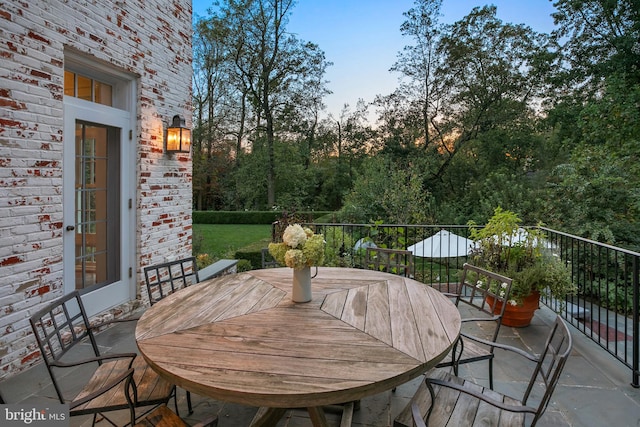 view of patio terrace at dusk