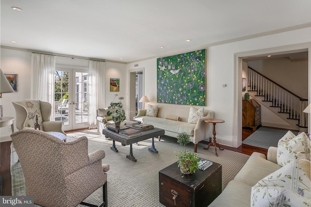 living room with french doors and hardwood / wood-style flooring