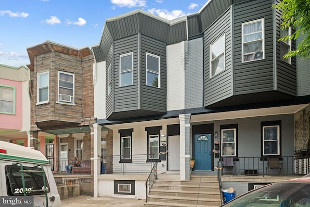 view of front of home with central AC unit and covered porch