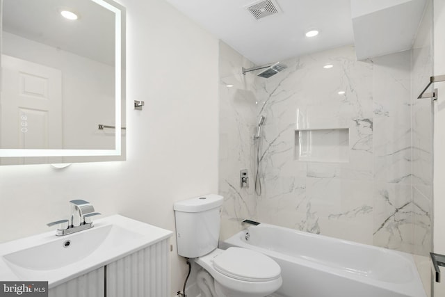 full bathroom with toilet, tiled shower / bath combo, and vanity