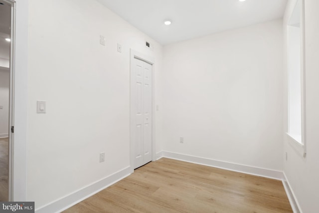 spare room featuring light hardwood / wood-style flooring