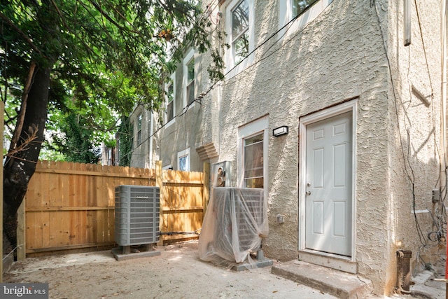 view of side of home with cooling unit