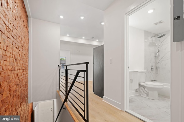 hallway with light wood-type flooring