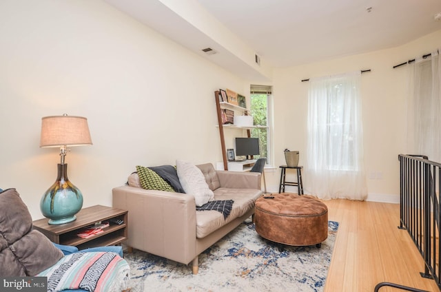 living room with light hardwood / wood-style flooring