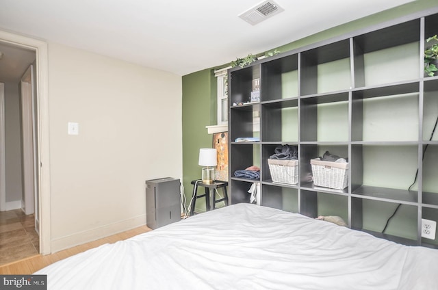 bedroom with light hardwood / wood-style flooring