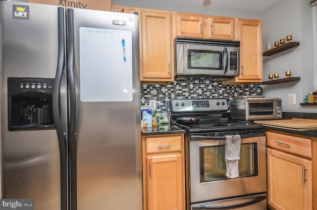 kitchen featuring stainless steel appliances, tasteful backsplash, and light brown cabinets