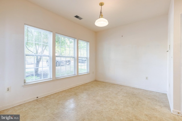 empty room featuring light tile patterned floors