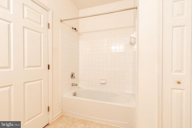 bathroom with tile patterned floors and tiled shower / bath combo