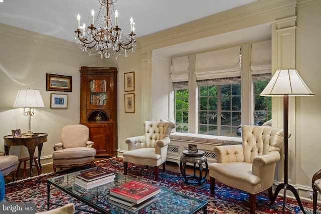 living area featuring baseboards, wood finished floors, and crown molding