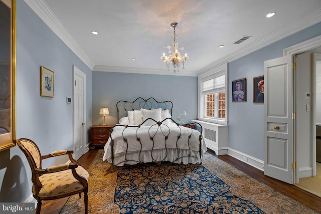 bedroom with visible vents, dark wood-type flooring, ornamental molding, a chandelier, and baseboards