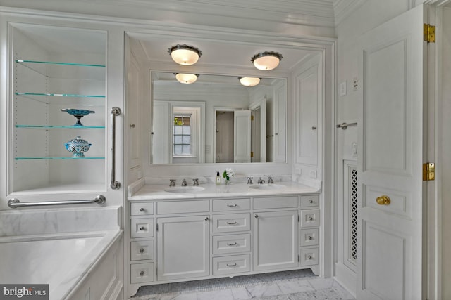 full bathroom with crown molding, marble finish floor, a sink, and double vanity