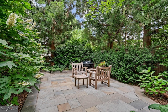 view of patio / terrace featuring fence