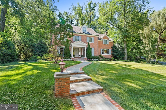 view of front of property with a front lawn