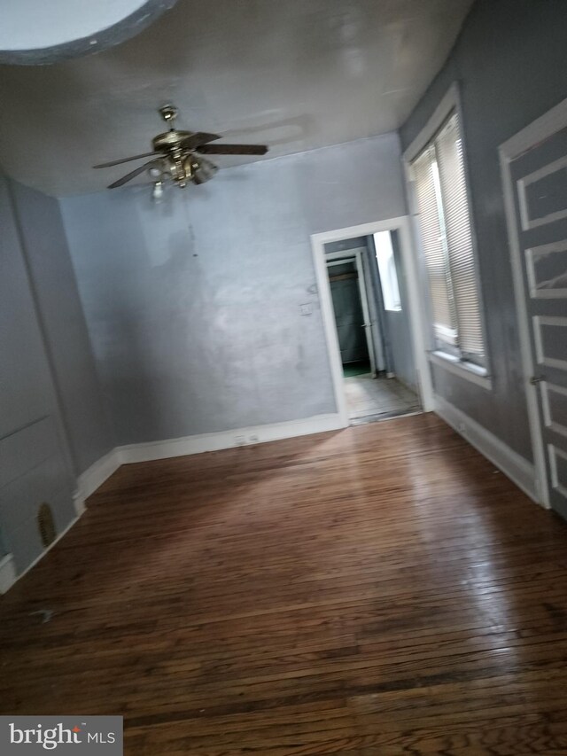 interior space featuring dark hardwood / wood-style flooring and ceiling fan