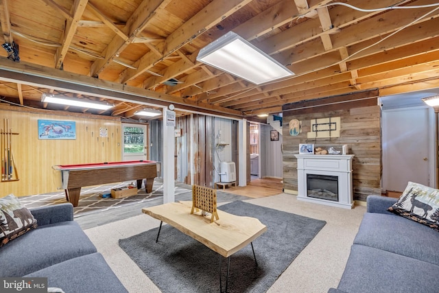 living room featuring billiards and wooden walls