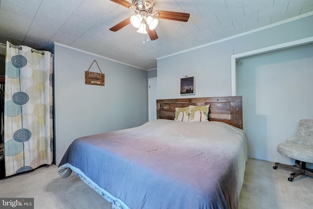 bedroom featuring ceiling fan, ornamental molding, and light colored carpet