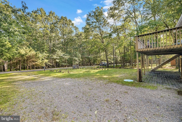 view of yard with a wooden deck