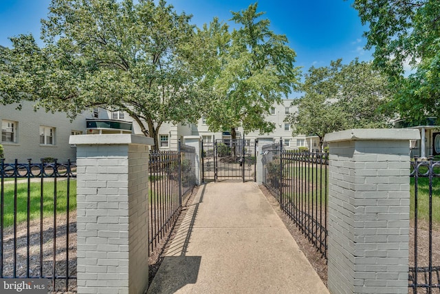 view of gate with fence