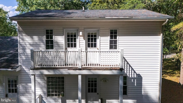 back of house with a balcony