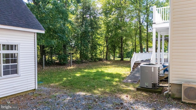 view of yard featuring ac unit and central AC unit