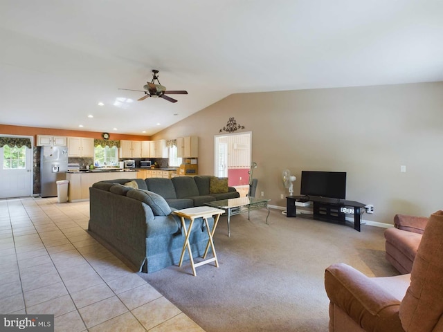 tiled living room featuring lofted ceiling and ceiling fan