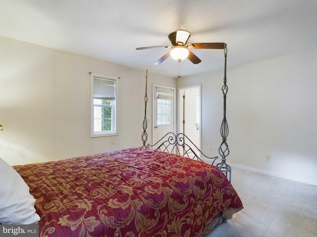 bedroom with ceiling fan and carpet floors