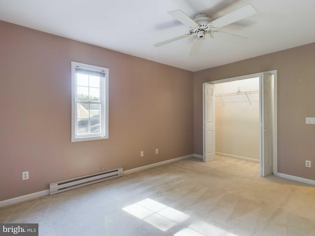 unfurnished bedroom with ceiling fan, a baseboard radiator, a closet, and light carpet